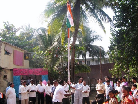 Mr. Prasad Mankar of HJS hoisting the National Flag